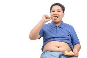 Obese fat boy eating potato chips isolated on white background, photo