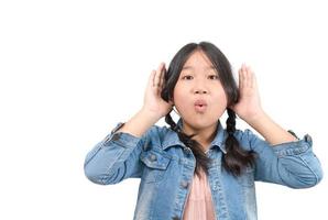 cute girl having hearing problem listening to something isolated photo