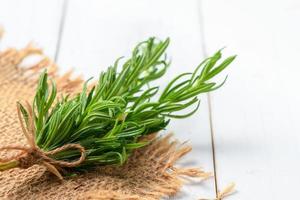 rosemary on wood background photo