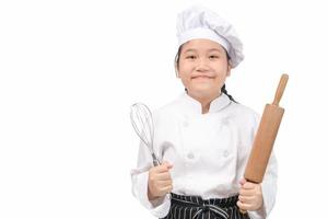 Little girl chef hold rolling pin and whisk isolated on white background, photo