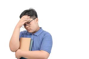 Obese boy student feel strain or  headache after learning online photo