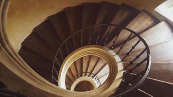 The stairs lead down in a circle. photo