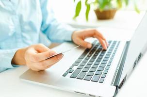 Woman office worker typing on the keyboard photo