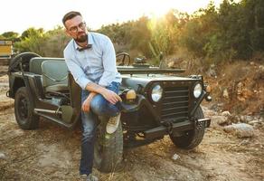 Man with adventure car photo