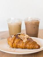 Freshly baked croissants and iced coffee photo