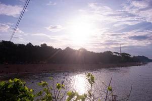 silhouette of trees on Balekambang beach photo