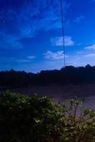 silhouette of trees on Balekambang beach photo