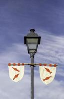 Lamppost with medieval banners photo