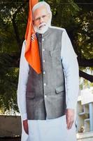 New Delhi, India - January 16 2023 - Prime Minister Narendra Modi cut out during BJP road show, the statue of PM Modi while attending a big election rally in the capital photo