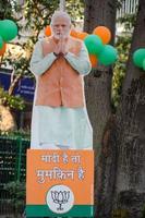 New Delhi, India - January 16 2023 - Prime Minister Narendra Modi cut out during BJP road show, the statue of PM Modi while attending a big election rally in the capital photo