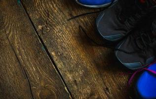 Sport, fitness, shoes, footwear  close up of sneakers on wooden background photo