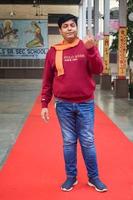 New Delhi, India - December 04 2022 - Unidentified people showing their ink-marked fingers after casting votes in front of polling booth of east Delhi area for MCD local body Elections 2022 photo