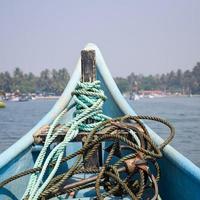 Amazing view from over long tail motor boat in Arabian sea in Goa, India, Ocean view from wooden boat with old ropes photo