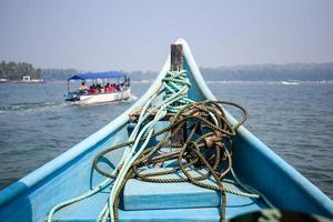 Amazing view from over long tail motor boat in Arabian sea in Goa, India, Ocean view from wooden boat with old ropes photo