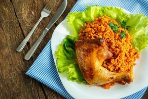 Tasty dish of chicken thigh with rice photo