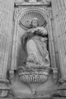 monochrome photography of religious statue small photo