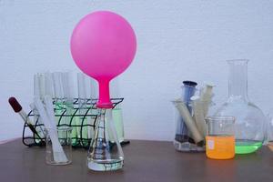 Science experiment , pink inflated balloon  on top of transparent test bottle. The experiment about air or gas reaction by using baking soda and vinegar.Concept,  Science Education photo