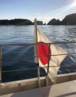 View from the ferry boat along the coast of Kii Katsuura, Japan, with Japanese flag photo