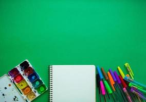 School supplies on blackboard background ready for your design photo