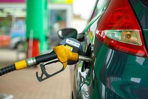 Car refueling on a petrol station close up photo
