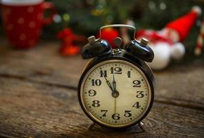 Vintage alarm clock on christmas background photo