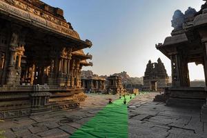 Vijaya Vitthala temple in Hampi with stone charriot in the background photo