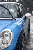 Hand wash with soap, pink foam on the body. Car washing with high pressure water. photo