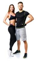 Athletic man and woman after fitness exercise on the white photo