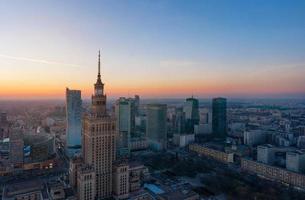 Aerial view of the business center of Warsaw Palace of Science and Culture and skyscrapers in the evening photo