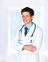 Portrait of the smiling doctor in interior photo