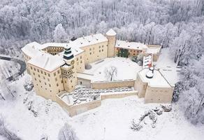 Aerial view oh historic renaissance castle Pieskowa Skala near Krakow in Poland in winter photo