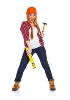 Young woman in helmet with the work tools on a white photo