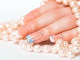 Beautiful female hands with french manicure photo