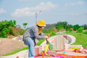 Chonburi, Thailand, 9, April, 2018 Chinese descendants cleaning tomb and offering prayers to ancestors during in Qingming Festival ,Tomb-Sweeping Day photo