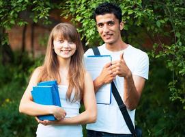 Two students studying in park photo