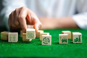 Companies are targeting net zero greenhouse gas emissions. Carbon credit concept.Tradable certificate to drive industry in direction of low emissions in efficiency cost. Wooden cubes with decrease CO2 photo