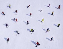 View of people snowboarding photo