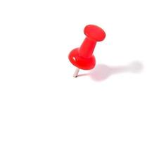 Push pin on white background photo