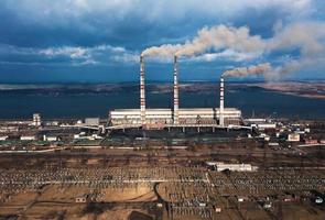 Old thermoelectric plant with big chimneys in a rural landscape photo