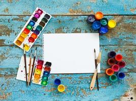 Art painting materials on wooden background photo