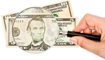magnifying glass and money photo