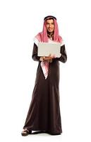 Young smiling arab with laptop isolated on white photo