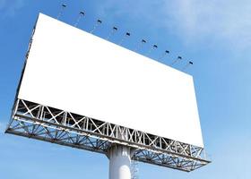 Outdoor pole billboard on blue sky background with mock up white screen and clipping path photo