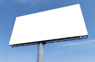 Outdoor pole billboard on blue sky background with mock up white screen and clipping path photo