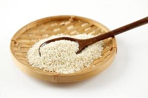 Peeled White Sesame Seed on Bamboo Plate photo