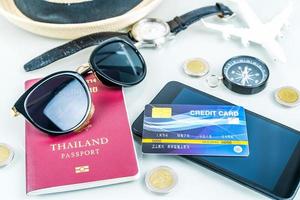 Traveling concept, smartphone, credit card on white photo