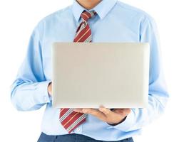 Businessman holding a laptop with clipping path photo