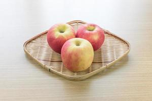 Red apple in basket photo