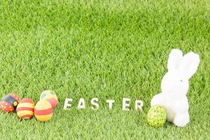 Bunny toy and Easter eggs with text photo