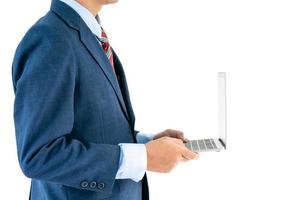 Businessman in suit holding a laptop photo